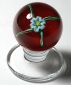 Charles Kaziun Jr. Miniature Tilted Pedestal Spider Lily Paperweight with Opaque Red Ground
